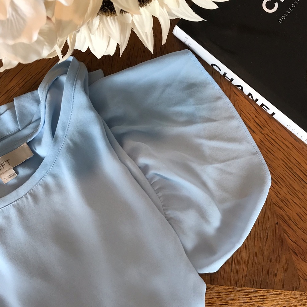 Powder blue blouse with flared sleeves